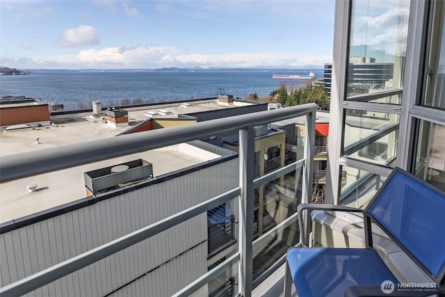 balcony featuring a water view