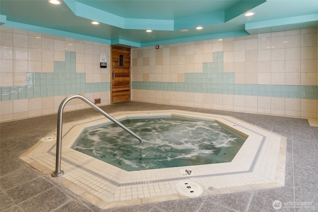 view of pool with an indoor in ground hot tub