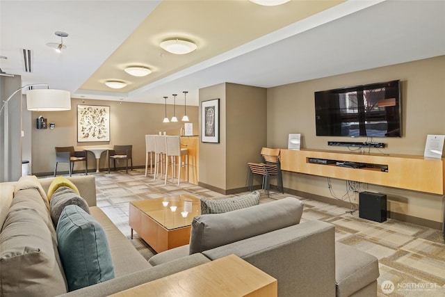 living area featuring visible vents and baseboards