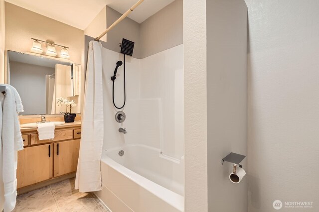 full bathroom featuring vanity, tile patterned floors, and shower / bath combo