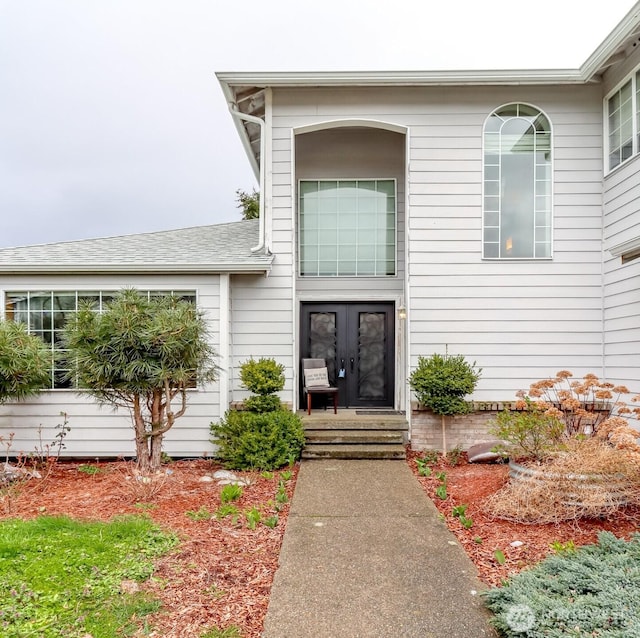 property entrance featuring french doors