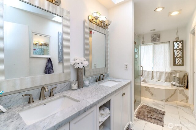 full bathroom with a sink, marble finish floor, and a stall shower