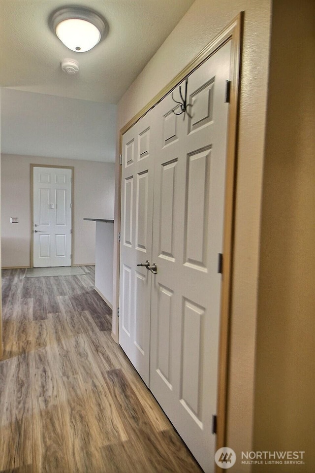 hall with wood finished floors