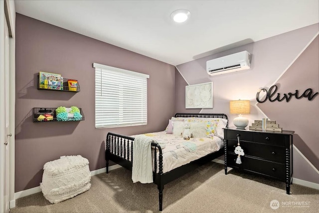 bedroom featuring carpet flooring, baseboards, and a wall mounted AC