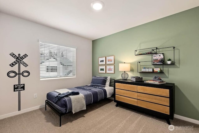 bedroom featuring carpet flooring and baseboards