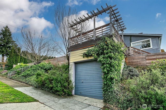 view of side of home with fence