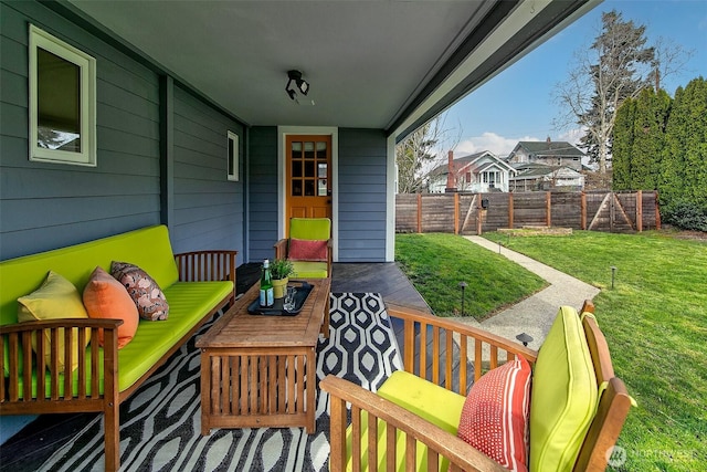 view of patio / terrace featuring an outdoor living space and fence