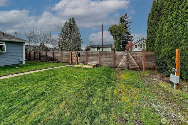 view of yard with a fenced backyard