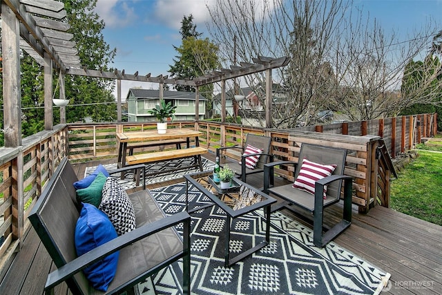 wooden deck with an outdoor living space and a pergola