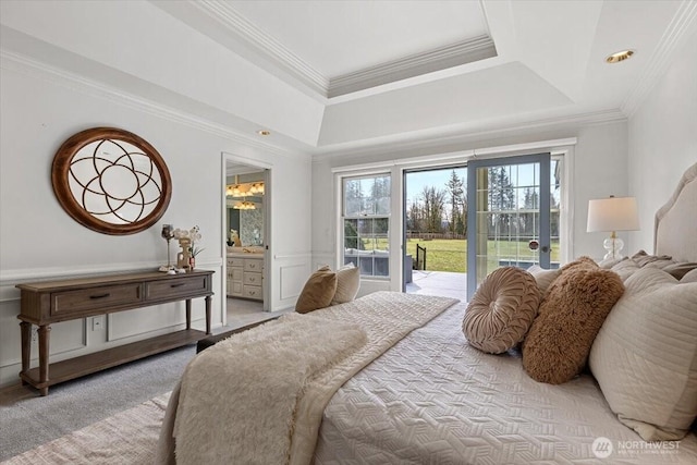 bedroom featuring light colored carpet, ensuite bath, ornamental molding, and access to outside