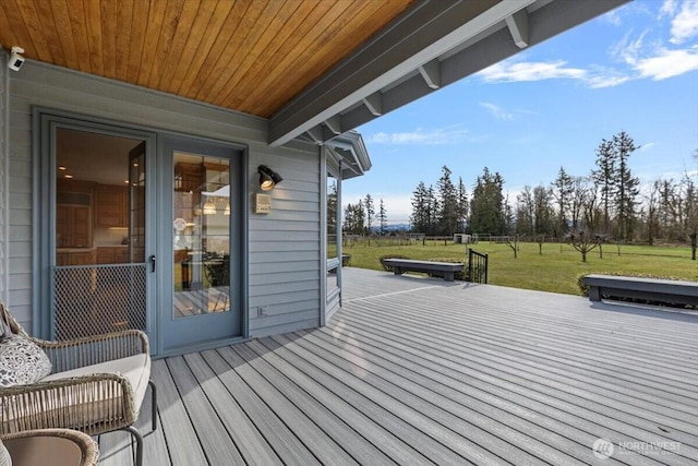 wooden terrace with a yard