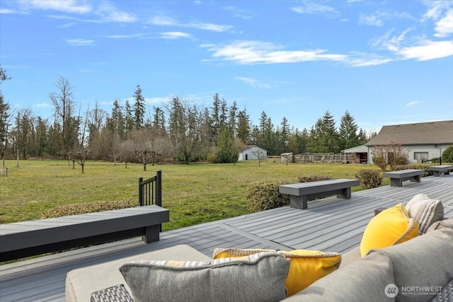 exterior space featuring an outdoor living space, an outdoor structure, a storage shed, and a yard