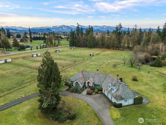 bird's eye view featuring a rural view and a mountain view