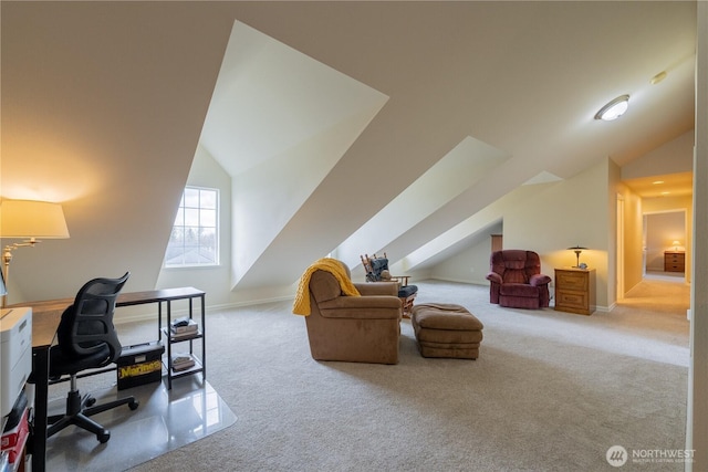 office space with baseboards, lofted ceiling, and carpet flooring