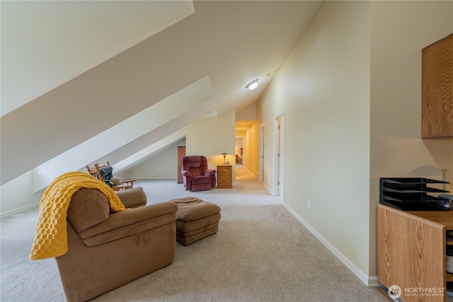 interior space with lofted ceiling, baseboards, and carpet floors