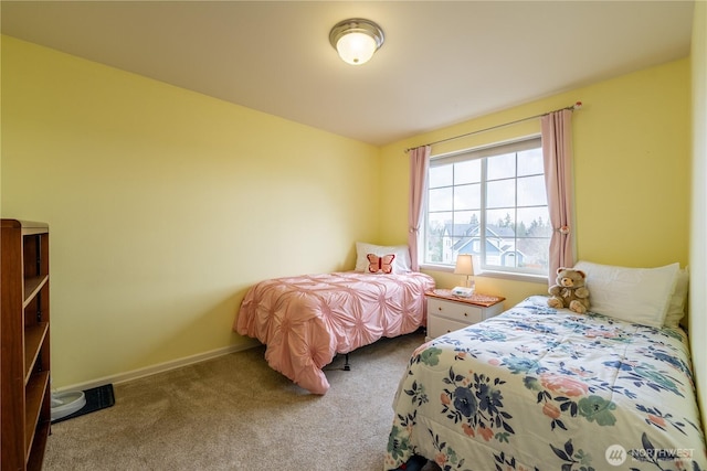 bedroom with baseboards and carpet flooring