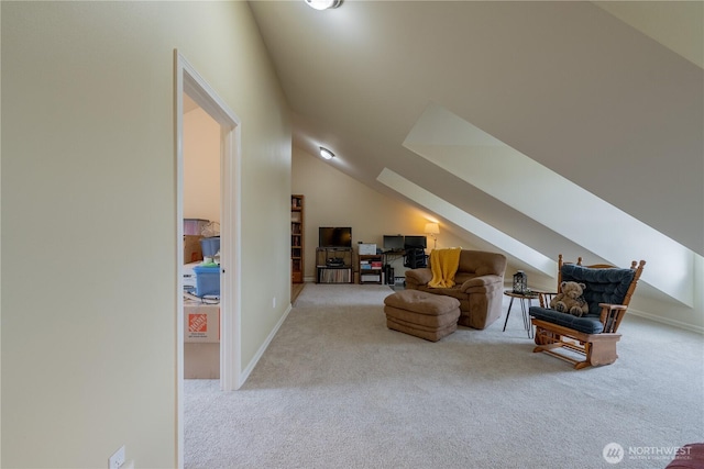 interior space with vaulted ceiling with skylight, baseboards, and carpet floors