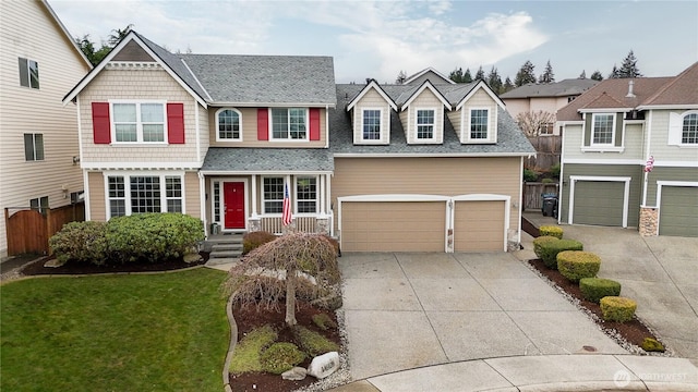 view of front of property featuring fence, concrete driveway, a front yard, a shingled roof, and an attached garage