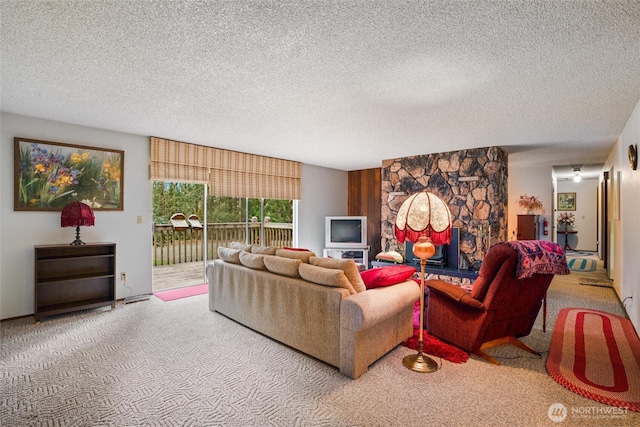 living area with carpet and a textured ceiling