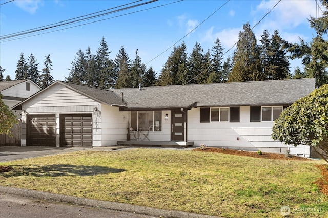 ranch-style home featuring aphalt driveway, an attached garage, a front yard, and roof with shingles