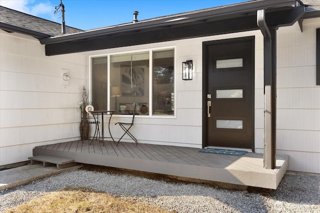 entrance to property with a wooden deck