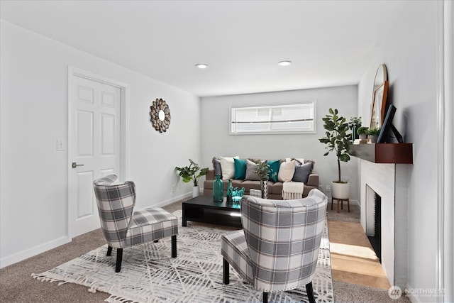 living area with carpet flooring, recessed lighting, a fireplace, and baseboards
