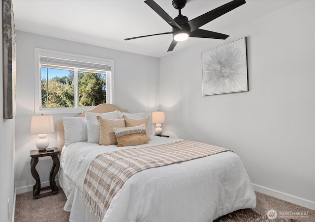 bedroom with a ceiling fan, carpet, and baseboards