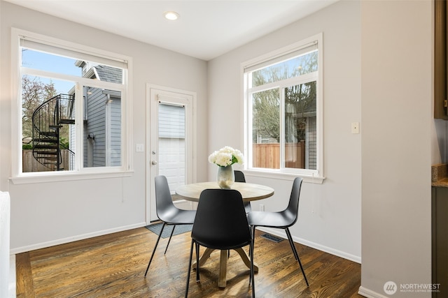 dining room with recessed lighting, baseboards, and wood finished floors