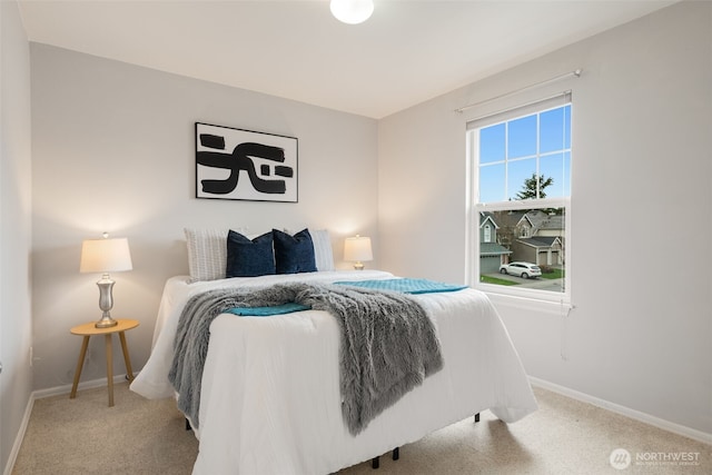 carpeted bedroom with baseboards