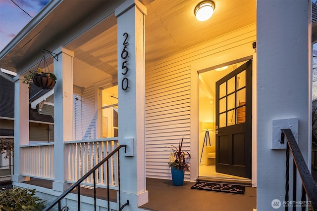 property entrance featuring a porch