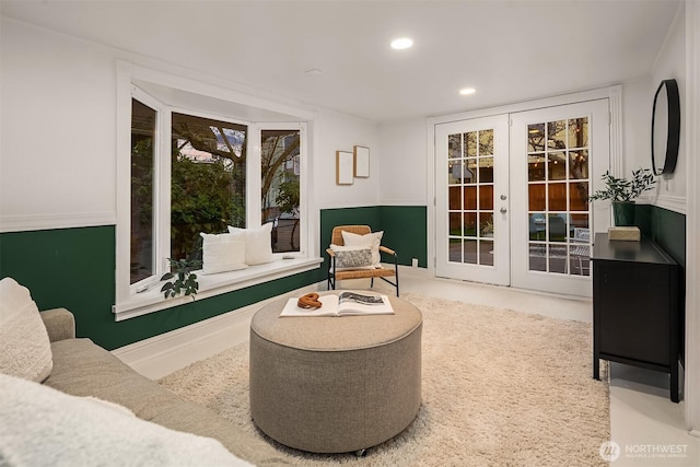 living area with recessed lighting and french doors