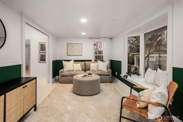 living area with recessed lighting and baseboards