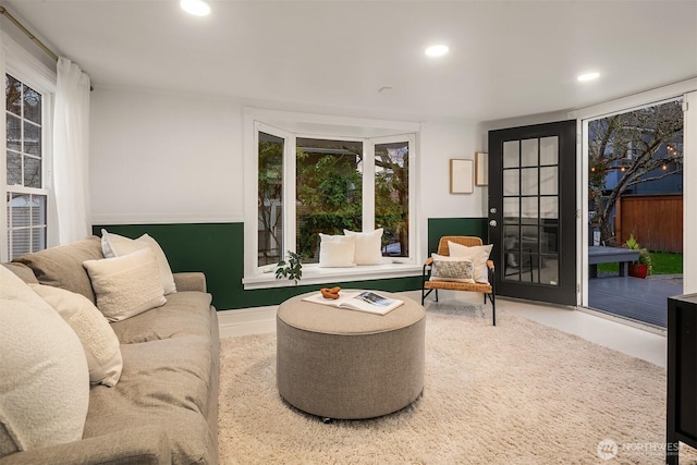 living room with recessed lighting and baseboards