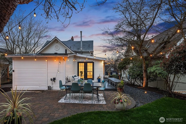 back of property featuring a patio area and french doors