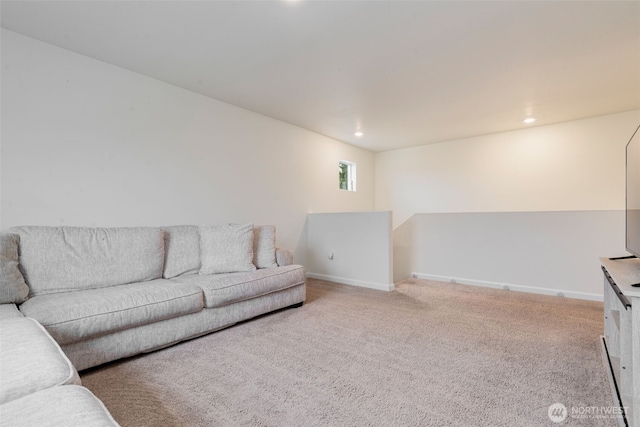 living area with recessed lighting, baseboards, and light colored carpet