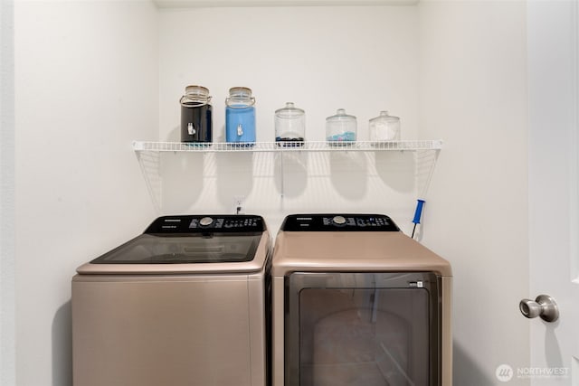 clothes washing area featuring laundry area and independent washer and dryer