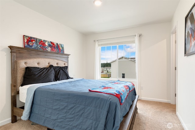 bedroom with baseboards and carpet floors