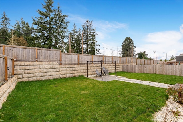 view of yard with a fenced backyard and a patio area