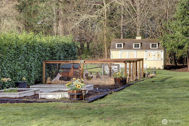 view of yard with an outdoor structure and a vegetable garden