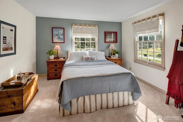 bedroom featuring baseboards and carpet floors