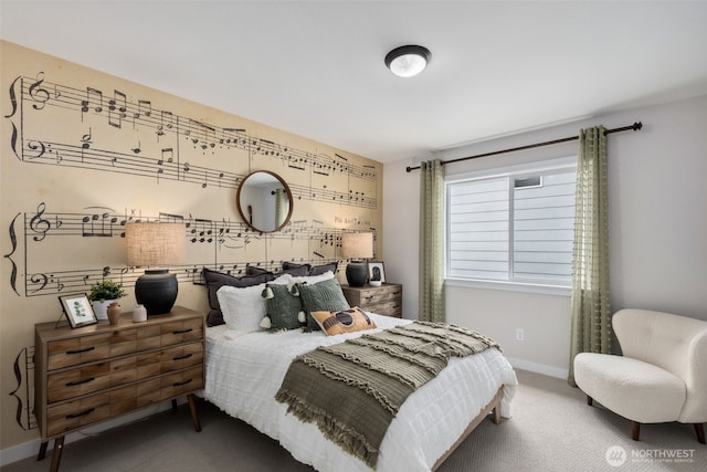 carpeted bedroom featuring baseboards