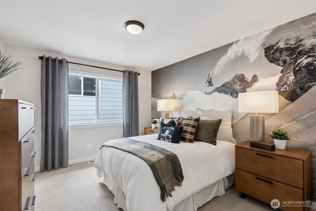 bedroom featuring baseboards and carpet floors