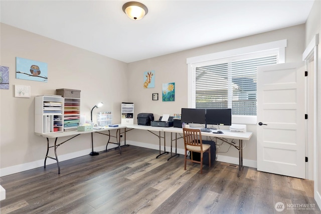 office area with baseboards and wood finished floors