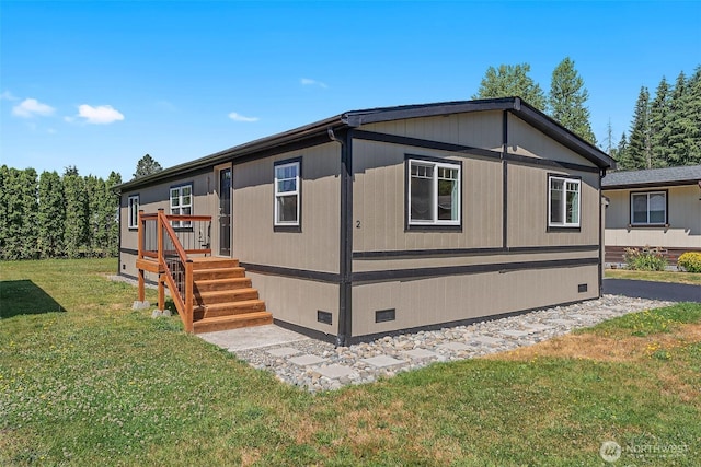 view of home's exterior featuring crawl space and a lawn