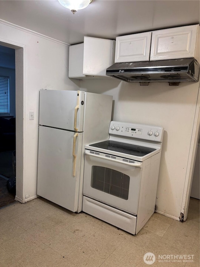 kitchen featuring baseboards, under cabinet range hood, light floors, white appliances, and white cabinetry