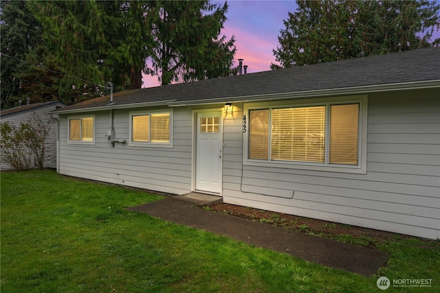 ranch-style home with a front yard