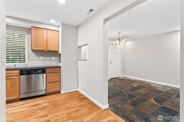 kitchen with dark countertops, visible vents, baseboards, dishwasher, and recessed lighting