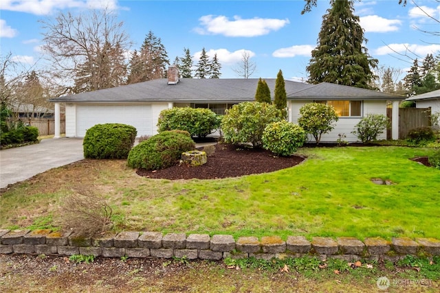 ranch-style home with a front yard, fence, driveway, an attached garage, and a chimney