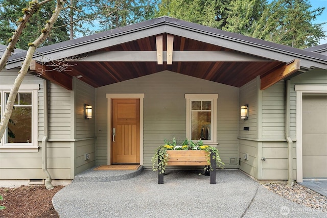 entrance to property featuring crawl space and an attached garage