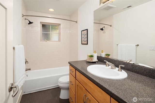 full bath featuring visible vents, tub / shower combination, toilet, and vanity